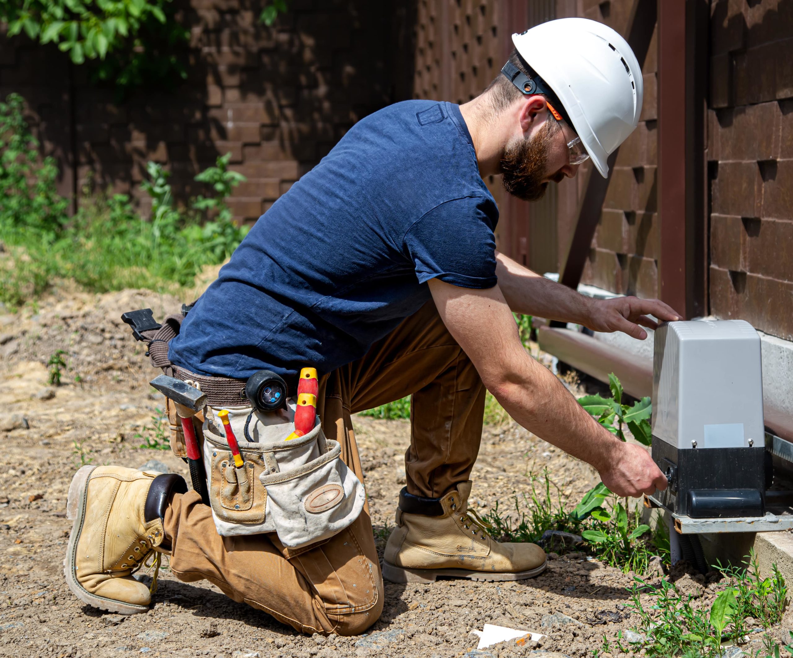 electrician-builder-work-servicing-fuselage-industrial-switchboard-professional-overalls-with-electrician-s-tool-min